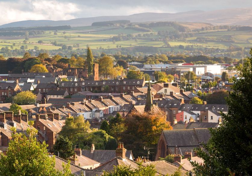 Looking across Penrith  and its business district to the Lake District Hills and Cumbria